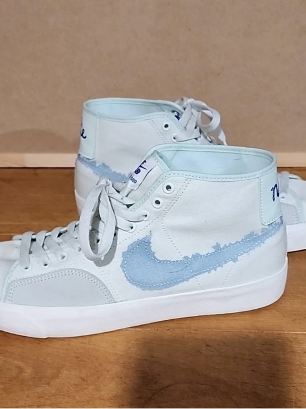 Nike men’s High-Top Sneakers in Pale Blue and White